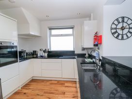 A kitchen with cabinets and countertop at The Swanage Rail Lookout in Swanage