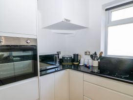 A kitchen with appliances and utensils at The Swanage Rail Lookout in Swanage