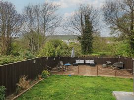 A garden with outdoor furniture and grass at The Swanage Rail Lookout in Swanage