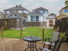 A garden with a table and chairs at The Swanage Rail Lookout in Swanage
