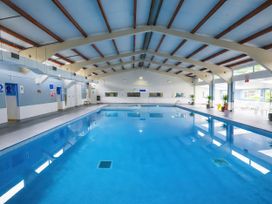 An indoor pool area with a swimming pool at Chalet 58 - The Beach House Kingsdown
