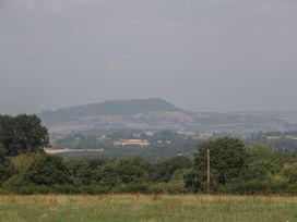 A landscape with hills and trees at Hollie in Raglan