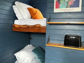 A bunk bed with pillows in a bedroom at Acres Meadow, Maiden Newton