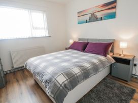 A bedroom with a bed and nightstands at The Island's View in Gortahork, County Donegal