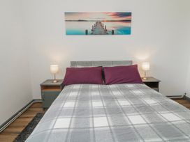 A bedroom with a bed and bedside lamps at The Island's View in Gortahork, County Donegal