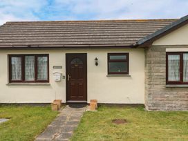 A house with a front door and pathway at 14 Bosvigo in Ruan Major near Penhale