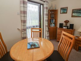 A dining room with a table and chairs at 14 Bosvigo Ruan Major near Penhale