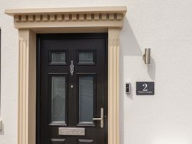 A front door with a nameplate and doorbell at Wagtail Cottage Lyme Regis