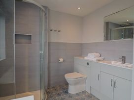A bathroom with shower and sink at Wagtail Cottage in Lyme Regis