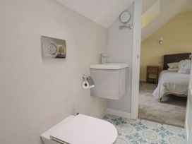 A bathroom with a toilet and sink at Wagtail Cottage in Lyme Regis