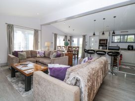 A living room with sofas and a coffee table at Angel Lodge - No 27 Fornham St Genevieve near Bury St Edmunds