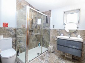 A bathroom with a shower and toilet at Angel Lodge - No 27 near Bury St Edmunds