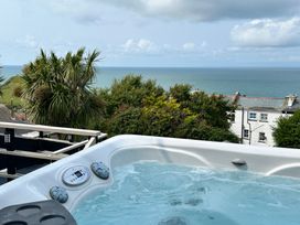 A hot tub overlooking the ocean at Combe View in Ilfracombe