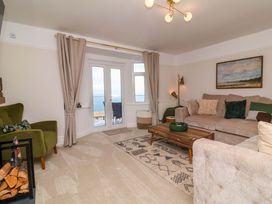 A living room with a sofa and coffee table at Combe View in Ilfracombe
