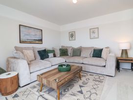 A living room with a sofa and coffee table at Combe View Ilfracombe