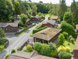 An aerial view of cabins and trees at Lodge 3 At Pound Farm Crook near Kendal