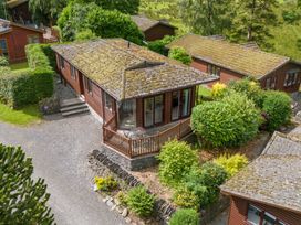 An exterior view of a cabin surrounded by greenery at Lodge 3 At Pound Farm Crook near Kendal