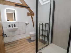 A bathroom with a sink and a shower at Y Stabl in Cerrigydrudion
