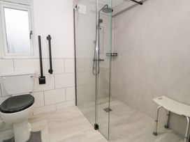 A bathroom with a shower and toilet at Y Côr in Cerrigydrudion