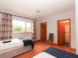 A bedroom with two beds and a window at Fort Lodge