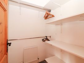 A closet with shelves and hangers at Fort Lodge