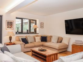 A living room with a sofa and coffee table at Lower Moorwood in Moorwood near Bovey Tracey