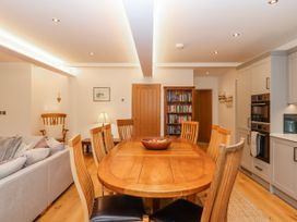 A dining area with a table and chairs at Lower Moorwood Moorwood near Bovey Tracey