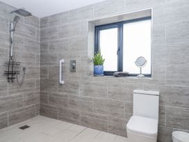 A bathroom with a shower and a toilet at Lower Moorwood in Moorwood near Bovey Tracey