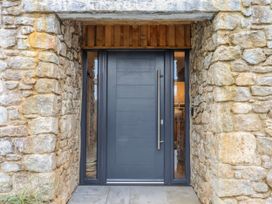 A front door with a stone wall at Lower Moorwood in Moorwood near Bovey Tracey