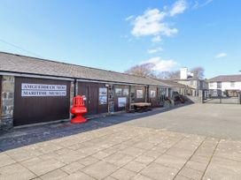 An outdoor view of a maritime museum with signage at Harbwr Hideaway Porthmadog