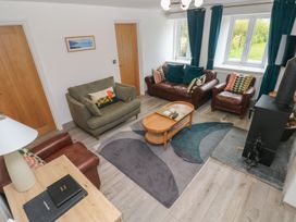 A living room with sofas and a coffee table at Folly Cottage Llanteg near Saundersfoot