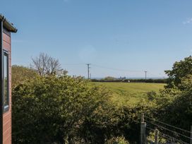 A view of a field and ocean at Magnolia Lodge in Whitby