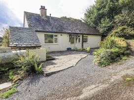 A cottage with a patio and garden at Tethers End in Lindeth near Bowness-On-Windermere