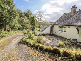 An outdoor view of a house and driveway at Tethers End in Lindeth near Bowness-On-Windermere