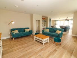 A living room with sofas and a coffee table at Carrowmore North in Doonbeg, County Clare