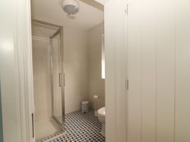 A bathroom with a shower and toilet at Carrowmore North in Doonbeg, County Clare