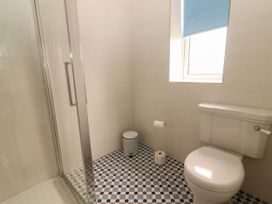 A bathroom with a shower and toilet at Carrowmore North in Doonbeg, County Clare