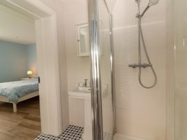A bathroom with a shower and sink at Carrowmore North, Doonbeg, County Clare