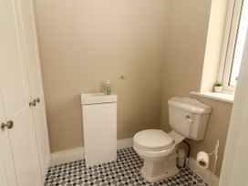 A bathroom with a sink and toilet at Carrowmore North in Doonbeg, County Clare