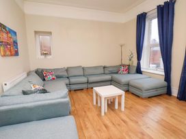 A living room with a sofa and coffee table at Wellington Lodge in Bridlington