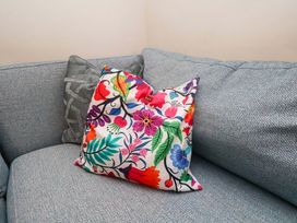 A colorful pillow on a couch at Wellington Lodge in Bridlington