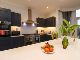 A kitchen with appliances and a fruit bowl at Wellington Lodge in Bridlington