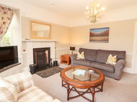 A living room with a coffee table and sofa at Bracken Howe in Ambleside