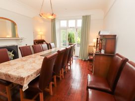 A dining room with a large table and chairs at Bracken Howe in Ambleside