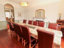 A dining room with a large table and chairs at Bracken Howe in Ambleside
