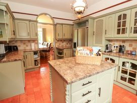 A kitchen with cabinets, countertop, and an island at Bracken Howe in Ambleside
