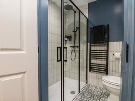A bathroom with shower and toilet at Coral Villa in Bridlington