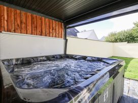 A hot tub located in an outdoor area at Station Hall in Cilgerran