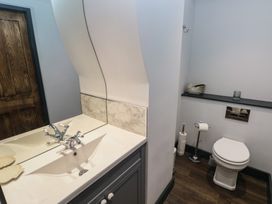 A bathroom with a sink and toilet at 9 Brython Place Tenby