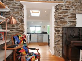 A living room with a view to the kitchen at 2 Glyddins 1910 Rock